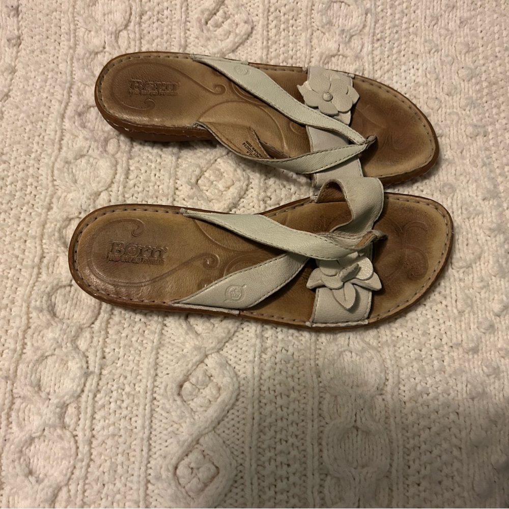 Born cute flip flops with leather straps and flower. In great shape, barely worn